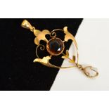 AN EDWARDIAN 9CT GOLD GEM PENDANT, of openwork design with central circular smokey quartz, scrolling