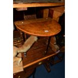 A VICTORIAN WALNUT OVAL TOPPED SUTHERLAND TABLE