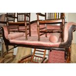 A VICTORIAN CARVED OAK TWO SEATER SOFA with a shaped back, scrolled arms, on turned feet and