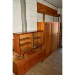 A 1960'S TEAK FOUR PIECE BEDROOM SUITE, comprising of two double door wardrobes (key) dressing table