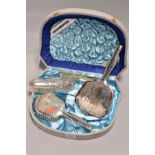 A CASED FOUR PIECE DRESSING TABLE SET, stamped 925, with foliate engraved decoration