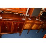 A REPRODUCTION MAHOGANY SERPENTINE SIDEBOARD, with three various drawers, together with a leather