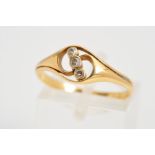 AN 18CT GOLD THREE STONE DIAMOND RING, designed as a diagonal line of three single cut diamonds