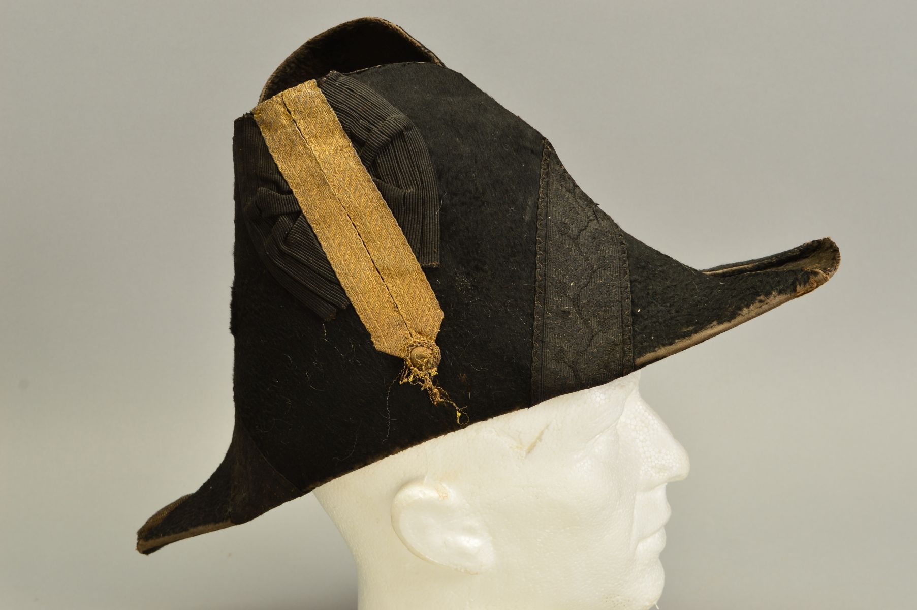 A POSSIBLY BLACK SILK MADE FRENCH ? NAPOLEONIC 'BICORNE' MILITARY HAT, with silver trim, no makers