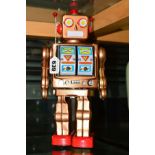 A LATE 20TH CENTURY TIN PLATE BATTERY OPERATED ROBOT, with walking action and panels on chest open
