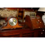 AN OAK MANTEL CLOCK together with an Edwardian walnut purdonium (2)