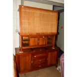 A CONTINENTAL MAHOGANY SIDEBOARD with three central drawers and campaign handles, together with a