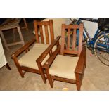 A NEAR PAIR OF LADIES AND GENTS ARTS AND CRAFTS OAK FIRESIDE CHAIRS (sd) (2)