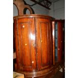 A GEORGIAN OAK AND MAHOGANY BANDED BARREL DOUBLE DOOR HANGING CORNER CUPBOARD and an Edwardian