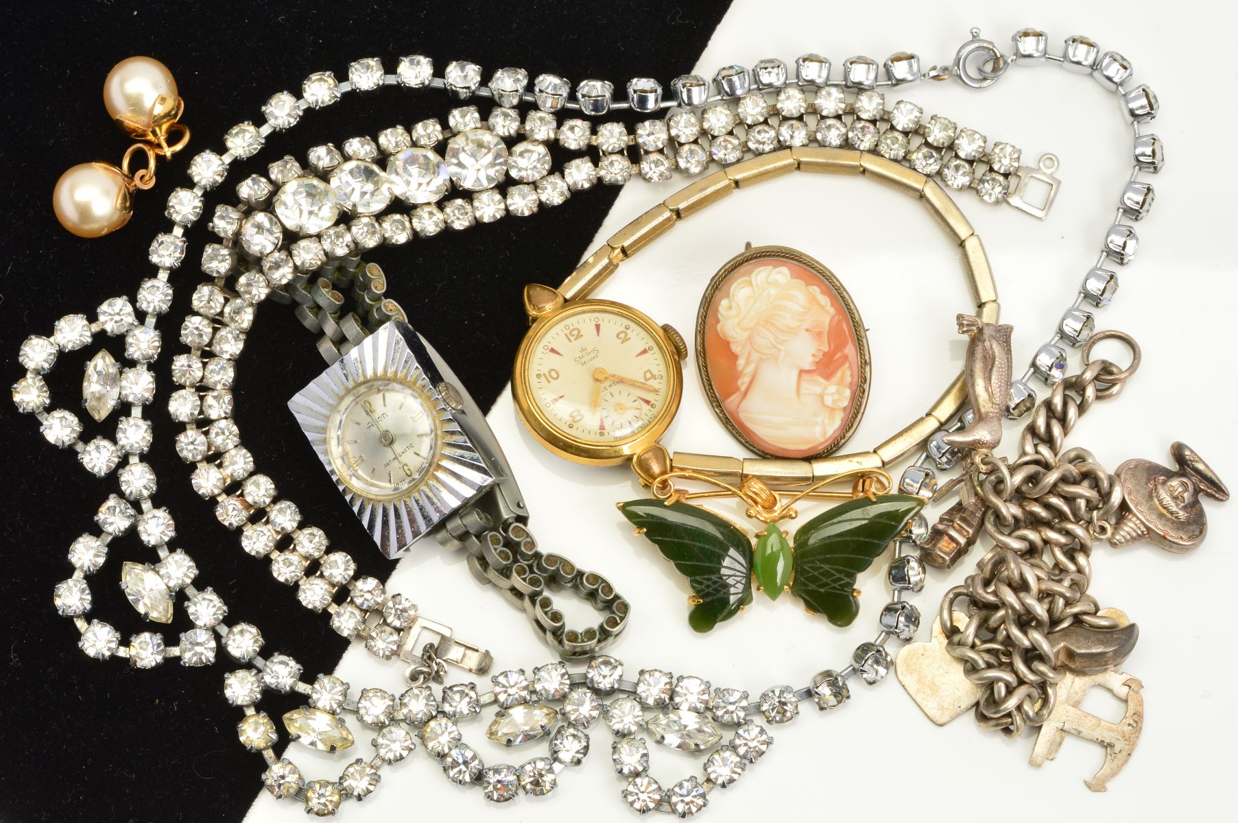 A SELECTION OF COSTUME JEWELLERY, to include charm bracelet, a cameo brooch, two watches etc