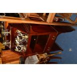 A REPRODUCTION EDWARDIAN STYLE MAHOGANY GLAZED SINGLE DOOR CABINET, the top with a raised shelf