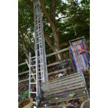 THREE VARIOUS ALUMINIUM LADDERS, together with a slatted garden bench with wrought iron bench