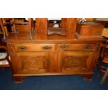 AN ART NOUVEAU OAK SIDEBOARD with a raised back, two long drawers and geometric panelled doors