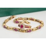 A 9CT GOLD DIAMOND AND RUBY RING AND BRACELET, the tiered cluster ring with central ruby to the
