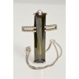 A MODERN DIAMOND AND GREEN TOURMALINE LARGE CROSS PENDANT, centring on a long rectangular tourmaline