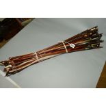 A BUNDLE OF OVER THIRTY VIOLIN BOWS and other bows for string instruments, some damaged