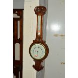 AN EDWARDIAN CARVED OAK ANEROID BAROMETER, height 86cm