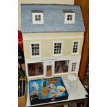 A MODERN DOLL'S HOUSE IN THE FORM OF AN ANTIQUES SHOP, with living quarters above, comes with