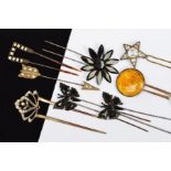 EIGHT LATE 19TH/EARLY 20TH CENTURY COSTUME HAIR PINS, including a pair of hinged butterflies with