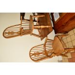 A PAIR OF VICTORIAN STYLE PINE AND BEECH WINDSOR ARMCHAIRS, the pierced splats flanked by