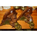 A PAIR OF PLASTER WALL BRACKETS, shaped as Dragons and painted wooden design, height 22cm (2)