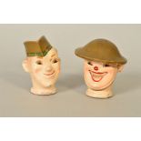 A PAIR OF STAN LAUREL AND OLIVER HARDY PLASTER DOLL HEADS, circa 1933, possibly had cloth bodies,