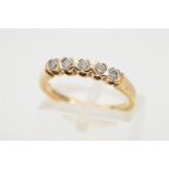 A 9CT GOLD FIVE STONE DIAMOND RING, the five brillaint cut diamonds within part collet settings,