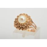 A PEARL RING, designed with a central cultured pearl within a tiered floral surround to the