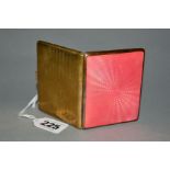 A GOLD PLATED AND PINK ENAMEL CIGARETTE CASE, engine turned decoration back and front, gilt