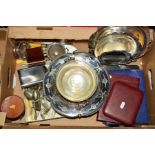 A BOX OF SILVER PLATE ETC, including two hip flasks, leather case of four beakers, cased cutlery and