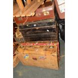 TWO VARIOUS TIN TRUNKS, together with a tan leather suitcase with travel labels and another suitcase