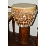 A HARDWOOD AND HIDE AFRICAN DRUM