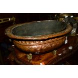 A VICTORIAN BRASS TWIN HANDLED WINE COOLER on brass claw feet