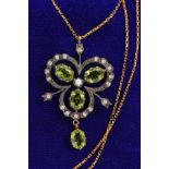 A MODERN PERIDOT AND DIAMOND PENDANT, Edwardian style, trefoil open work design, assessed as