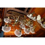 A BRASSED SEVEN PIECE LIGHTING SET, with wavy glass shades, comprising of a twin branch table