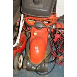 A FLYMO CHEVRON 32 ELECTRIC LAWN MOWER with grass box