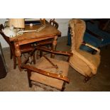 AN OAK FOLD OVER DINING TABLE AND TWO CHAIRS, an oak Victorian spoonback armchair (distressed - no