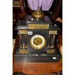 A LATE VICTORIAN SLATE MANTEL CLOCK, brass mounts of slavery, pair of fluted columns flanking an