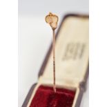 A PEARL STICKPIN, the terminal set with a pearl in a wire surround, length 47mm, approximate