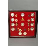 A LARGE WOODEN FRAME WITH TWELVE MOUNTED WHITE METAL COINS representing various regiments with a cap