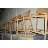 A SET OF SIX MODERN BEECH BAR STOOLS