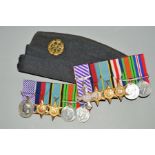 TWO WWII GROUPS OF MEDALS AND A RAF SLIDE CAP, with RAF badge as follows (a) Distinguished Flying