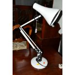 A MODERN ANGLE POISE WHITE GROUND DESK LAMP