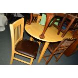 A MODERN BEECH EXTENDING DINING TABLE and two chairs (3)
