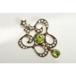 A MODERN PERIDOT AND DIAMOND PENDANT, Edwardian style, trefoil open work design, assessed as