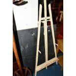 A PAINTED ARTISTS EASEL and a blackboard (2)