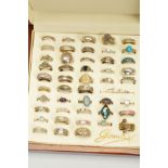 A BOX OF SILVER AND WHITE METAL RINGS, to include a blue jasperware ring, a butterfly wing ring,