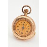 A LADIES SWISS STAMPED POCKET WATCH, gold gilt dial with black Roman numerals, foliate engraving