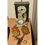 A PAICO NOVELTY WALL CLOCK in the form of a monkey, with a similar owl clock and two mantel clocks
