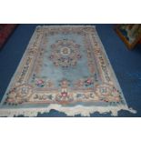 A CHINESE PALE BLUE AND CREAM CARPET SQUARE, 280cm x 182cm